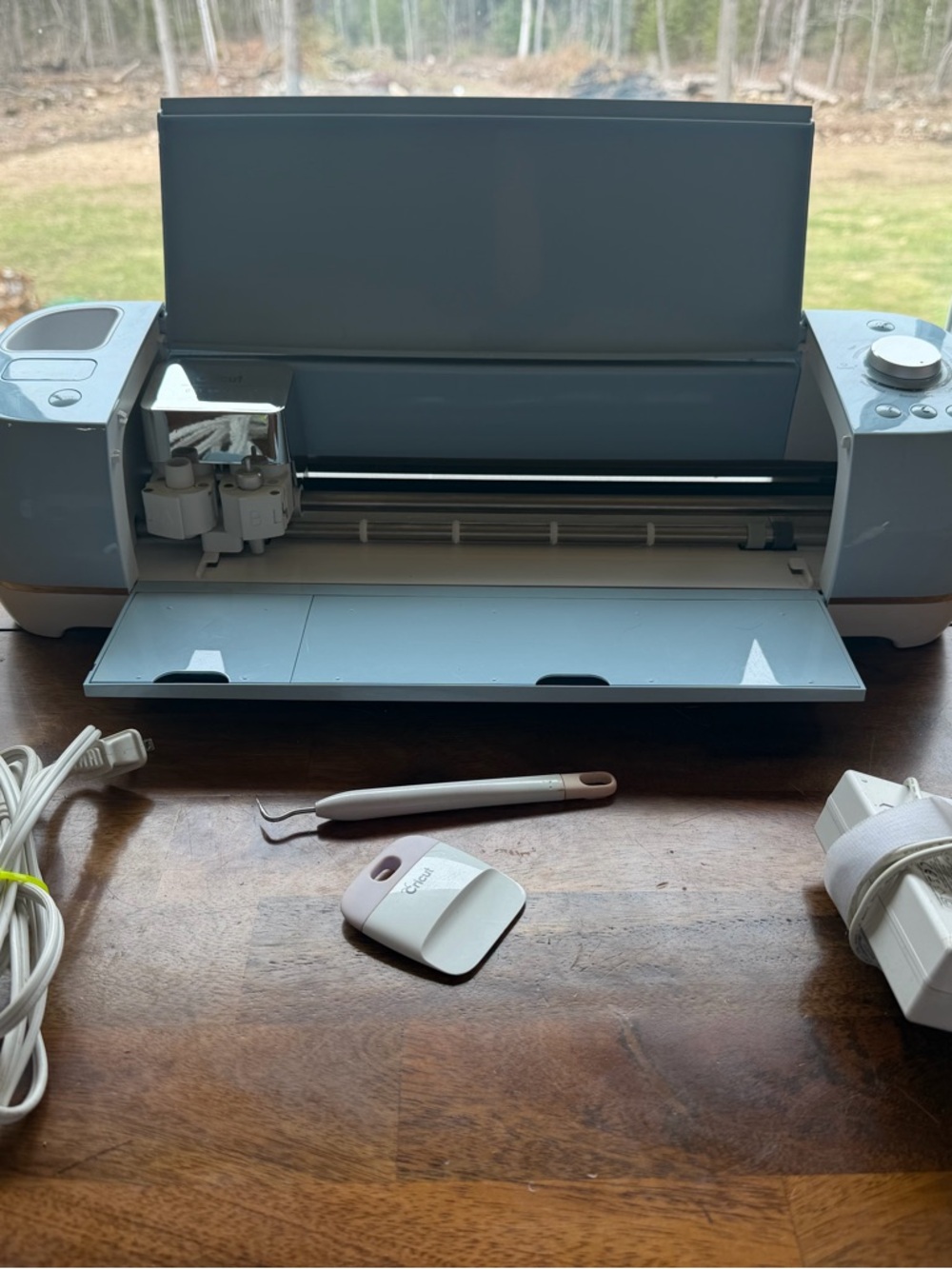 Cricut electronic cutting machine in light blue and white